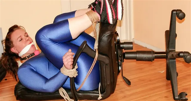 Poster: Spandex Bondage Piggy Poster: Spandex Bondage Piggy